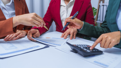 small business accounting team meeting three asian people with salary monthly charts data, basic business accounting and bookkeeping concept.