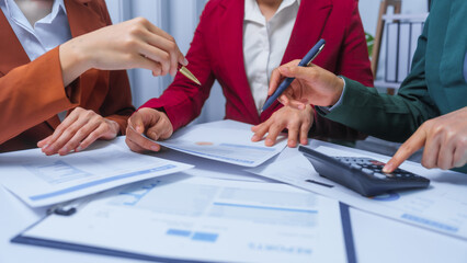 small business accounting team meeting three asian people with salary monthly charts data, basic business accounting and bookkeeping concept.