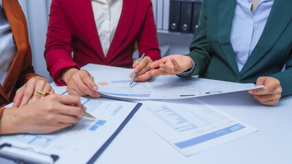 small business accounting team meeting three asian people with salary monthly charts data, basic business accounting and bookkeeping concept.