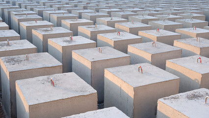 Background of many cubic Concrete Anchors for posting Undersea Mooring Buoys on industrial yard