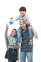 Obraz premium portrait of happy dad carry his son on a shoulder holding a love card for father's day