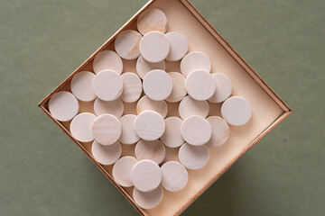 shallow box with neat arrangement of wood object