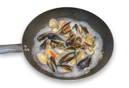 Cooking in a pan of clams, mussels and cockles