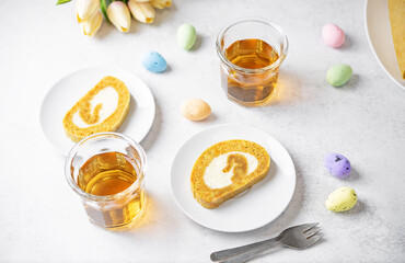 Easter caroot roll cake with cream cheese filling in a plate
