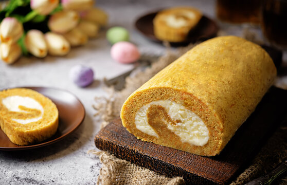 Easter caroot roll cake with cream cheese filling in a plate