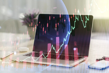 Multi exposure of abstract financial graph with world map on modern computer background, financial and trading concept