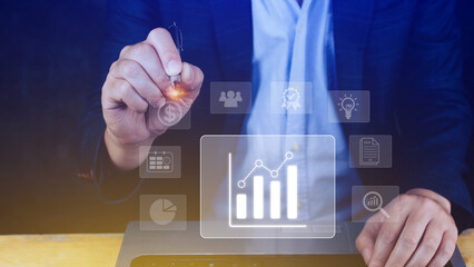 Fototapeta premium Big data analytics and business intelligence BI concept with chart and graph icons on digital screen interface and business people in the background.