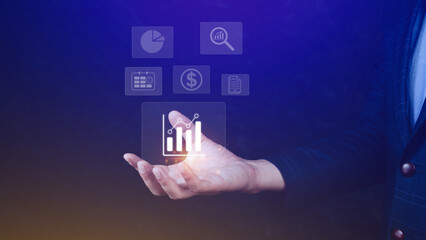 Big data analytics and business intelligence BI concept with chart and graph icons on digital screen interface and business people in the background.