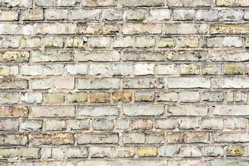 Brown brick wall. Horizontal decorative uneven blocks background. Urban architecture texture. Solid stone texture. Grunge brickwork structure. Tenement house texture