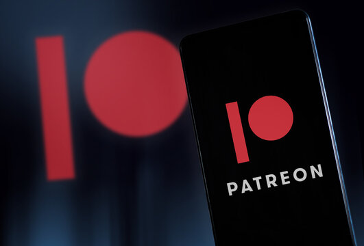 Patreon logo on smartphone display and background. Milan Italy January 2023
