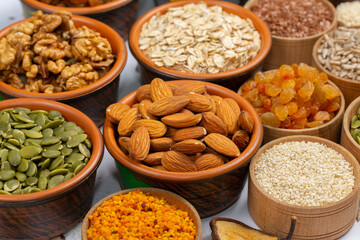 Healthy vegetarian food concept. Assortment of dried fruits, nuts and seeds on white background. Top view.