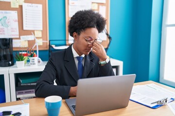 African american woman business worker stressed using laptop at office