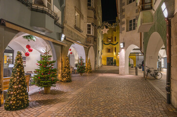 The beautiful town of Bolzano in the evening during Christmas time.  - obrazy, fototapety, plakaty