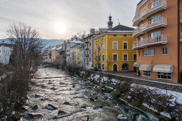 Brunico old town covered in snow during winter. Trentino Alto Adige, Italy. - obrazy, fototapety, plakaty