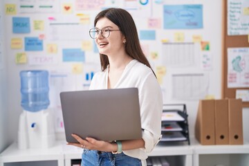 Young caucasian woman business worker using laptop working at office