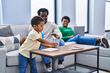 Fototapeta premium African american family drawing on notebook at home