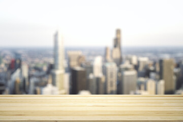 Blank table top made of wooden planks with beautiful blurry cityscape at daytime on background, mockup