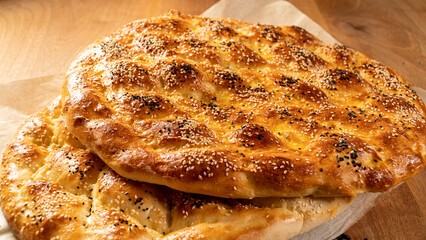 Close up of special Turkish Ramadan Pita pide bread on wooden table