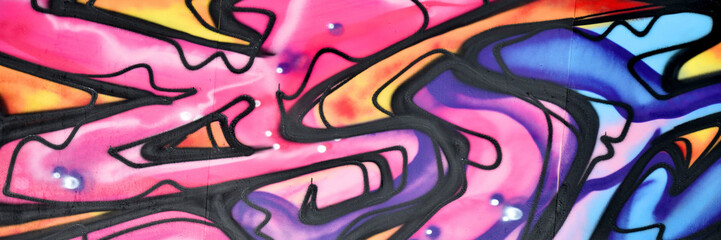 Colorful background of graffiti painting artwork with bright aerosol strips and beautiful colors....