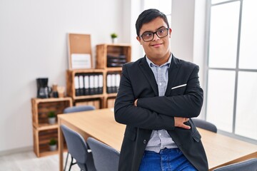 Down syndrome man business worker standing with arms crossed gesture at office