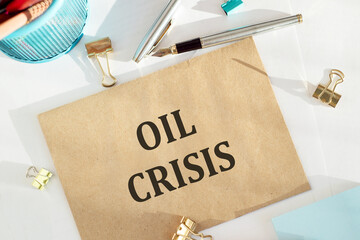 Oil crisis text written by envelope, marker on a light background. Business concept.