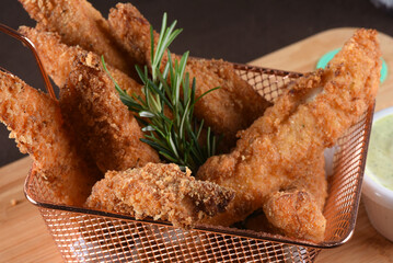 delicious pieces of fried fish breaded with flour