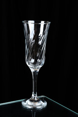 transparent glass crystal goblet, empty glass isolated on black background