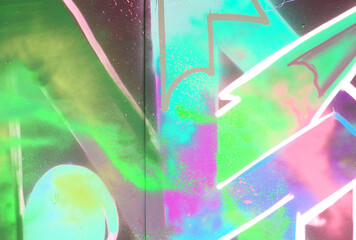 Colorful background of graffiti painting artwork with bright aerosol strips on metal wall. Old...