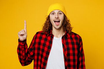 Young fun insighted smart proactive man wearing red checkered shirt white t-shirt hat holding index...