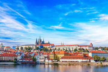 Fototapeta na wymiar Old town of Prague. Czech Republic over river Vltava with Saint Vitus cathedral on skyline. Praha panorama landscape view.
