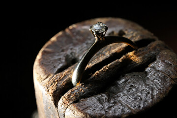 gold ring with brilliant cut diamond in goldsmith workshop