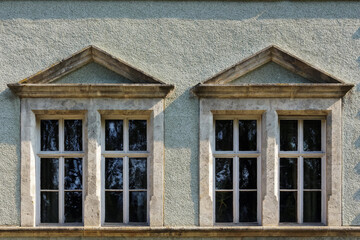 ancient windows on the vintage wall. antique architectural element in dust