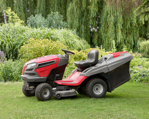 Garden tractor on grass in garden