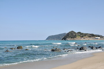beach landscape at couple rock Meotoiwa for lover with white column on beach in Fukuoka Japan 