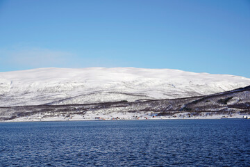 snowy weather and mountains in tromso fjords