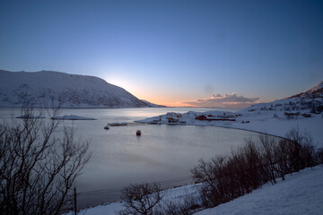 sunset time in fjords of tromso, norway