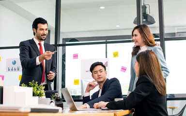 Group of business asian people wearing formal suits, talking, meeting and discussing their projects at office. Working and Teamwork Concept.