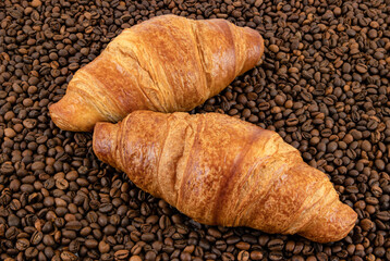 croissant with coffee beans