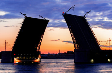 Silhouette of raised Palace bridge at white night, Saint Petersburg, Russia