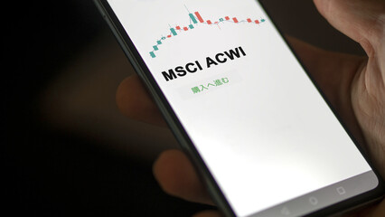 Investor analyzing an ETF. Funds stocks exchange ETFs Japanese text: msci acwi, buy. MSCI ACWI 証券取引所 投資 shares