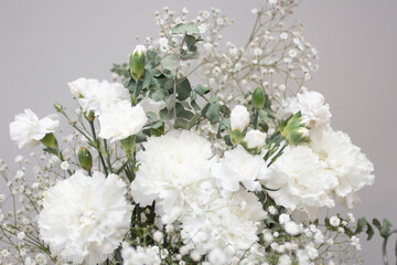 Bouquet of white flowers gypsophiles and carnations