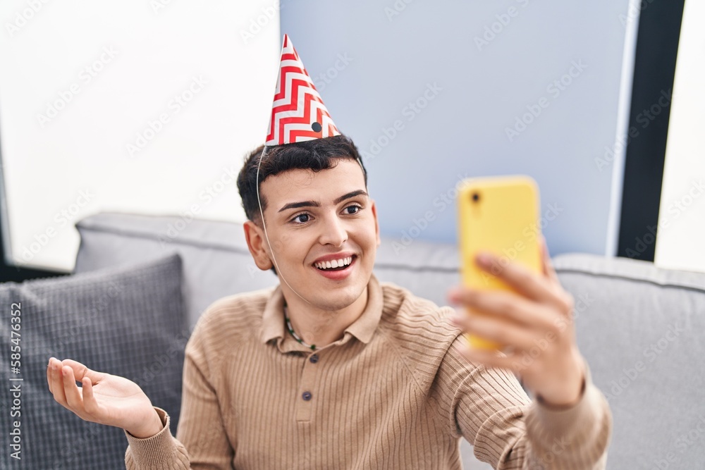 Canvas Prints Non binary person celebrating birthday doing video call celebrating achievement with happy smile and winner expression with raised hand