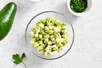 Avocado eggs salad in bowl
