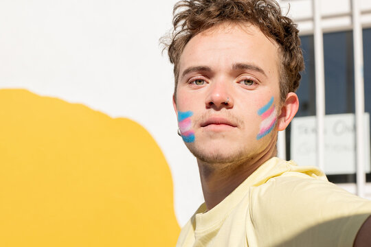 Transgender Man With Transgender Flag Painted On His Face