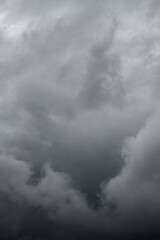 Natural background with dramatic and rainy grey clouds on sky