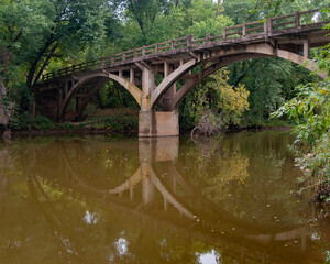 Fototapeta na wymiar Abandoned concrete bridge over War Eagle Creek in Northwest Arkansas
