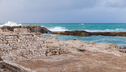 Coastal landscape with splashing waves at stormy Mediterranean Sea