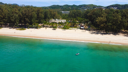 Aerial view of Bang Tao beach, Phuket, Thailand. Beautiful view of turquoise waters of Andaman Sea from above.