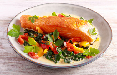 Grilled salmon fillet with creamy spinach