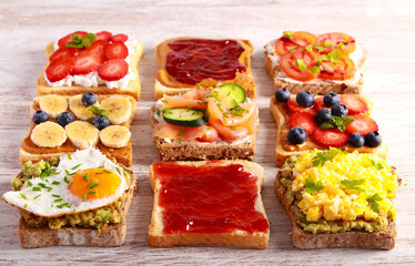 Selection of breakfast toasts with different toppings - savory and sweet.